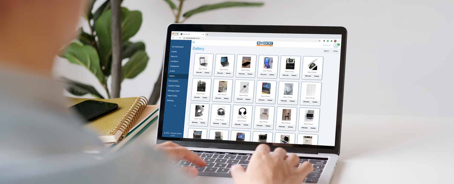 Person using a laptop to look at their assets on InVentry Audit and Compliance