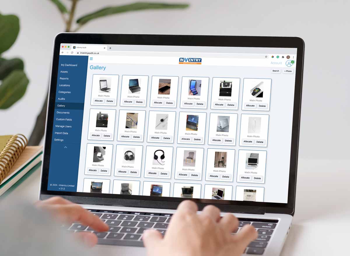 Person using a laptop to look at their assets on InVentry Audit and Compliance