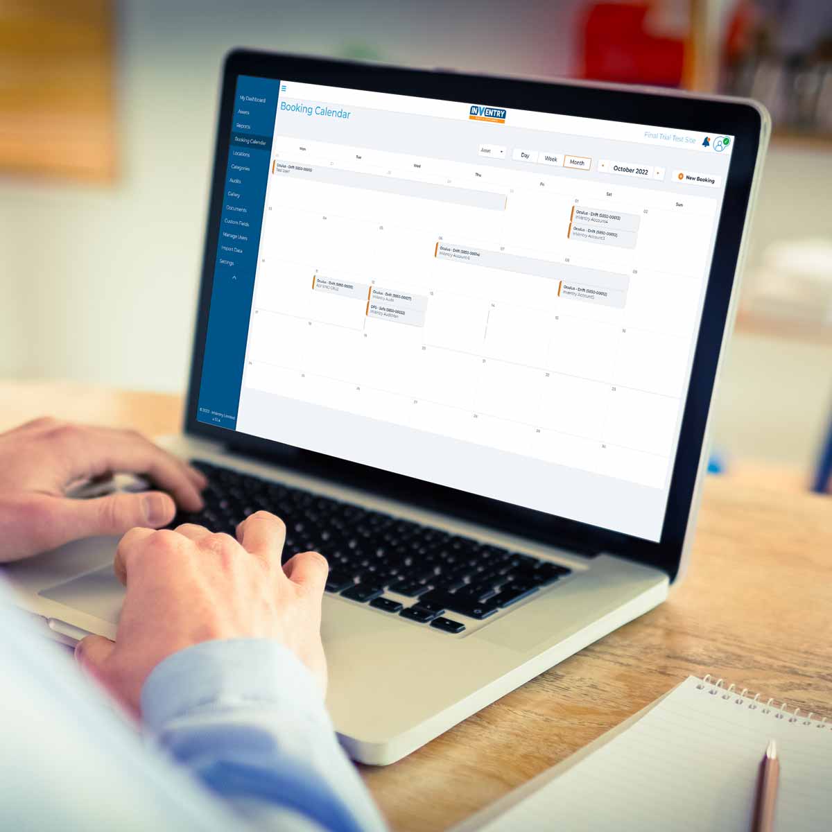 Person using a laptop to look at their asset calendar on InVentry Audit and Compliance