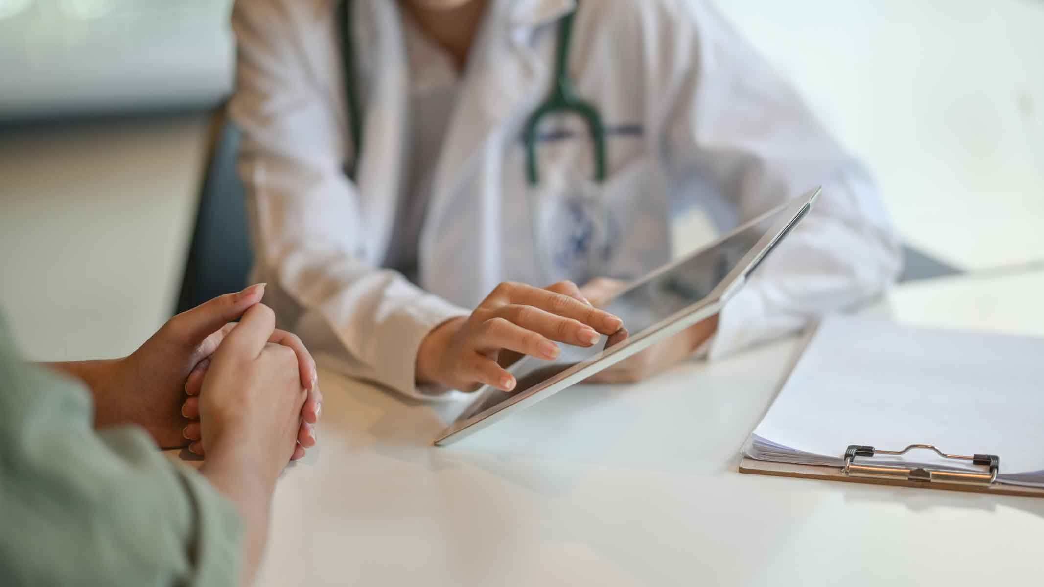 Doctor talking to Patient in Doctors Office