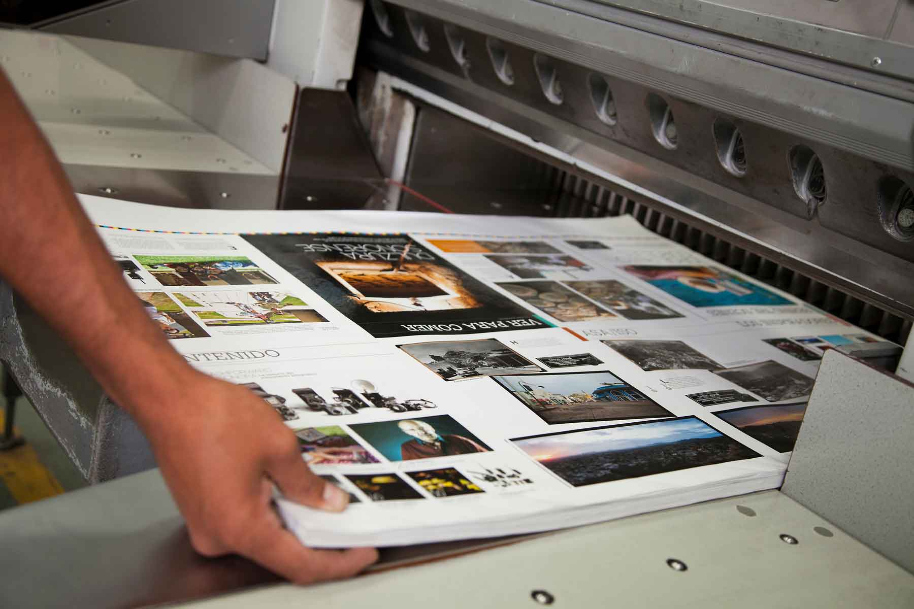 Person holding paper coming out of printer