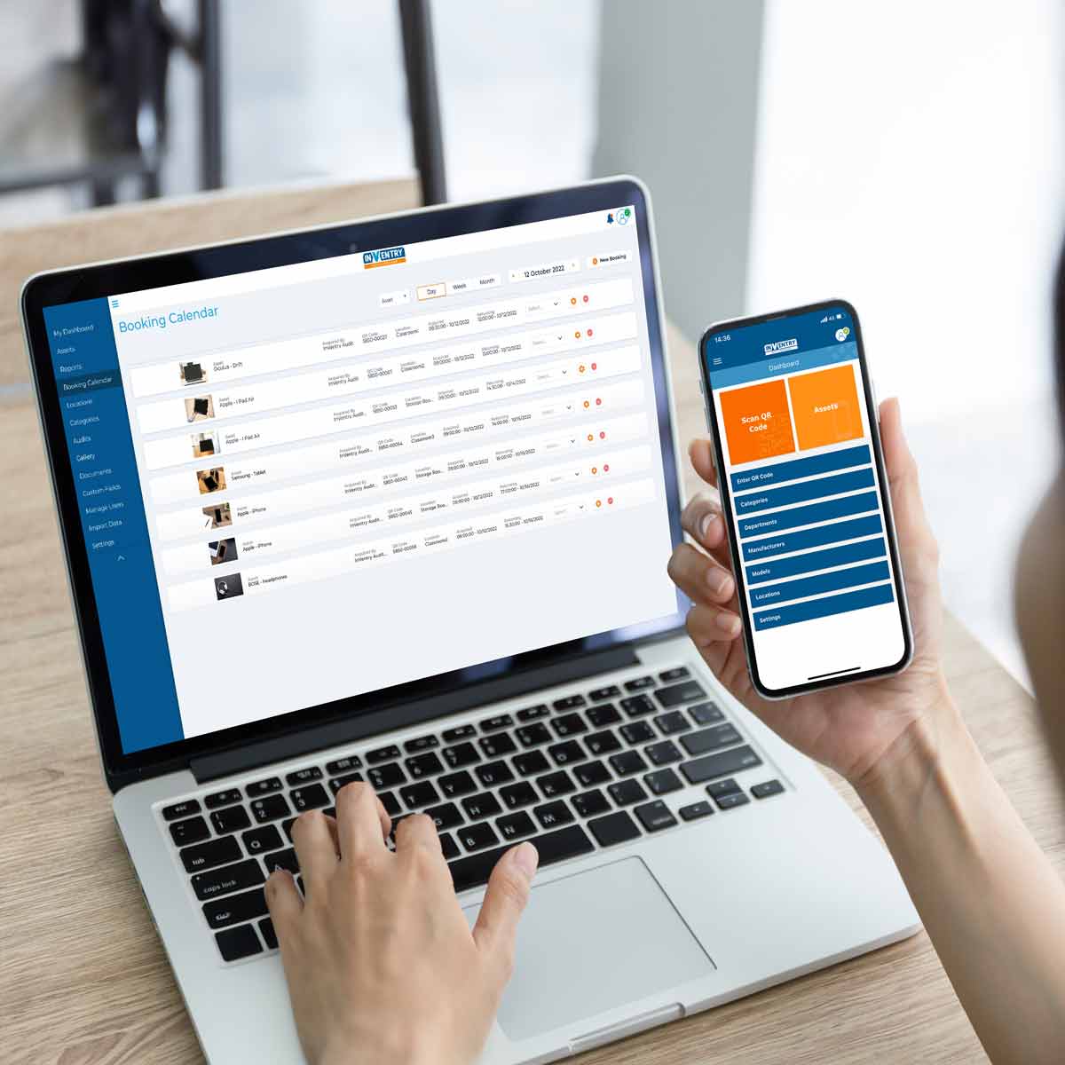 Person using a laptop and mobile phone looking at InVentry Audit and Compliance Person using a laptop and mobile phone looking at InVentry Audit and Compliance