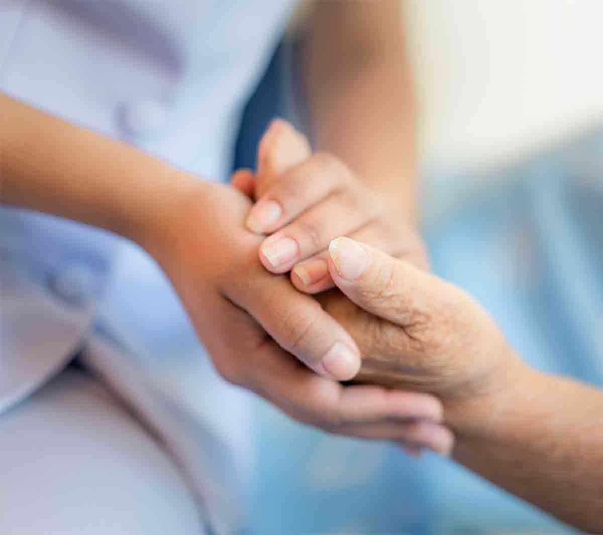 Care Giver Holding Care Receiver's Hand