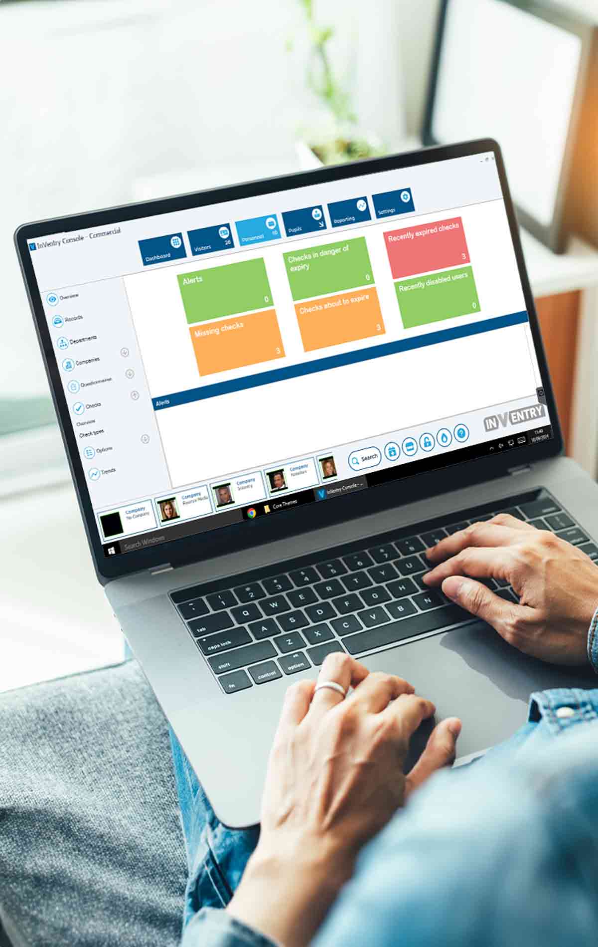 Person using InVentry Core on Laptop to Check DBS